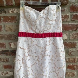 Ivory and pink cream lace dress with pink detail. Boutique Rubber Ducky brand.
